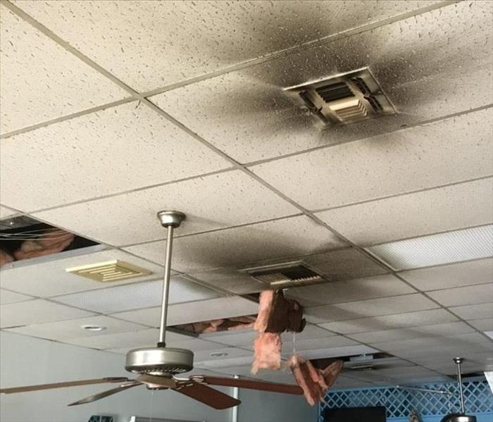 Ceiling with burnt ceiling tiles and soot